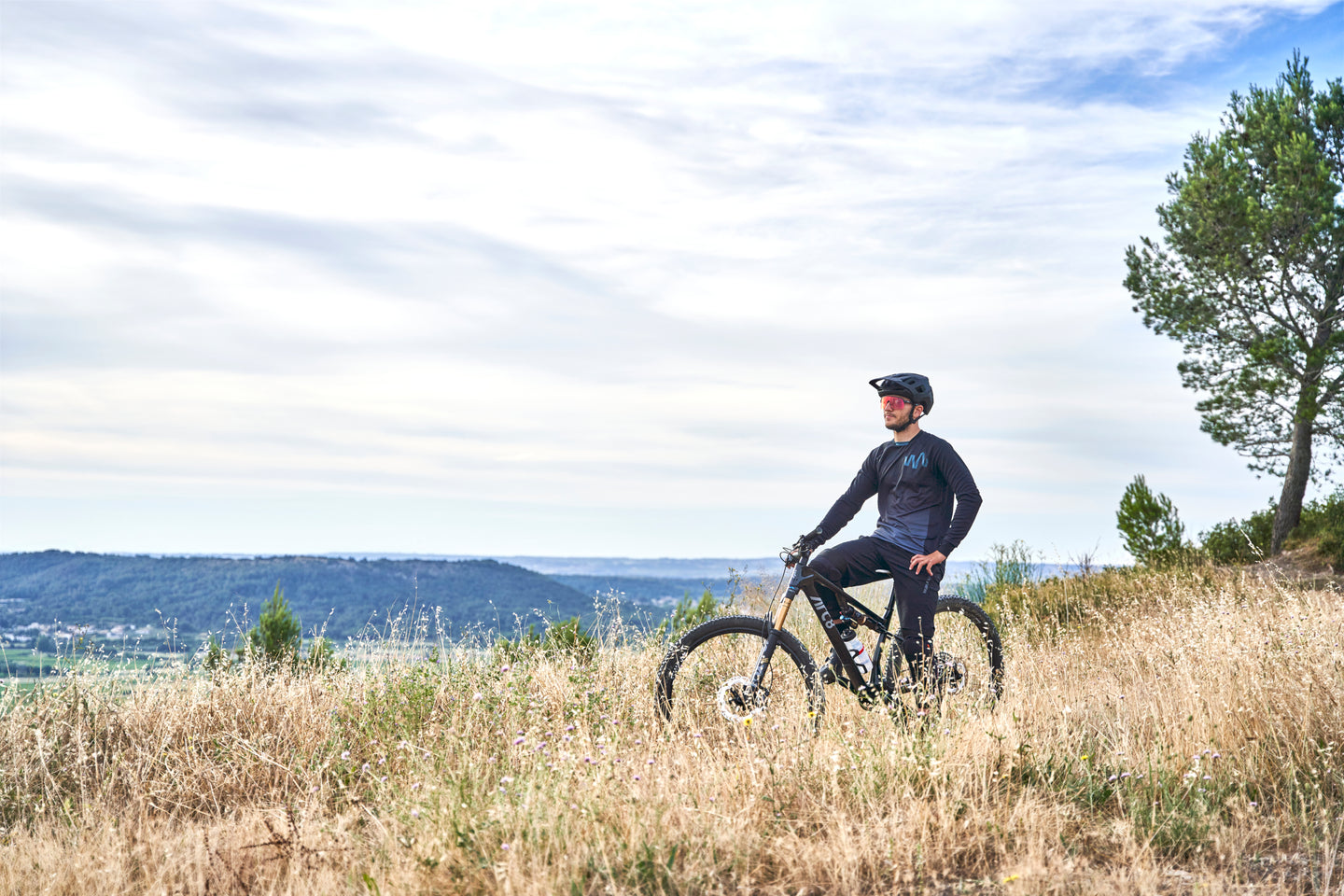 Mountain biker resting on trail