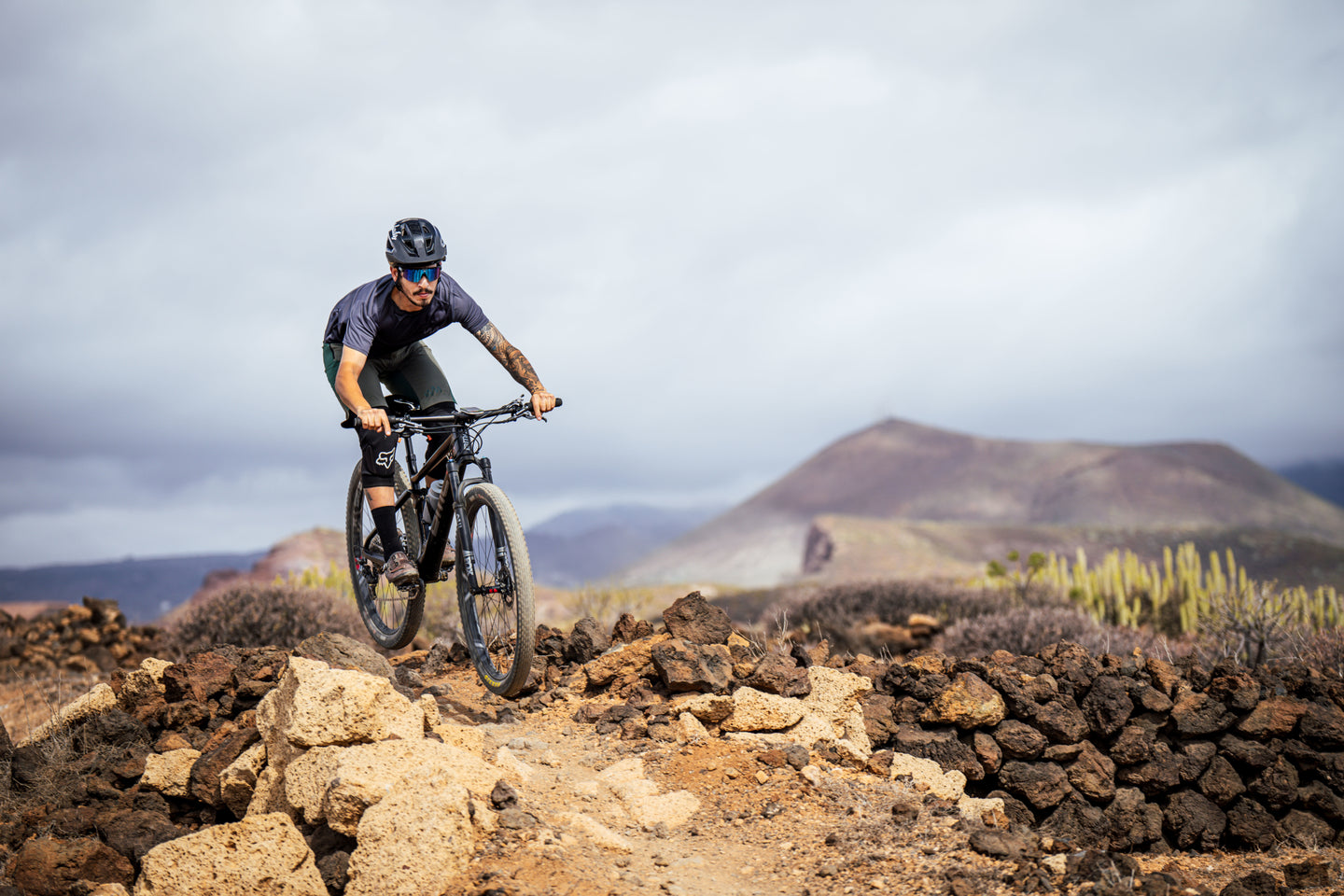 Rider descending rocky terrain