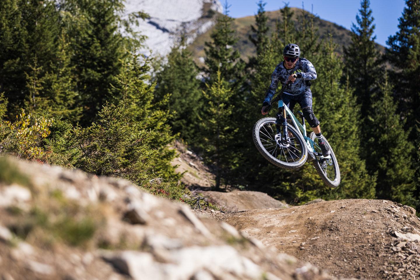 Rider jumping trail feature