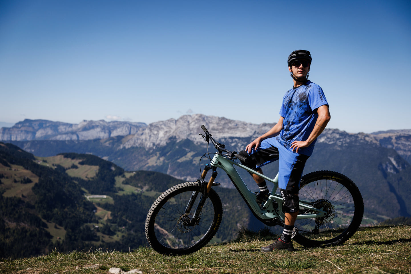 Mountain biker overlooking alpine valley